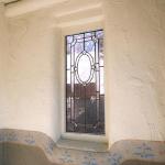 In that opening we put an old leaded glass window to add morning light to the front porch, but still maintaining that element of privacy