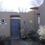 East yard adobe wall and gate added